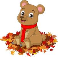 Cute cartoon bear in red scarf sits autumn leaves vector