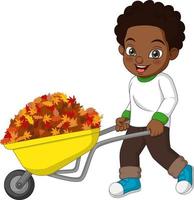 Lindo niño afroamericano empujando el carro con hojas de otoño vector