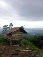 simple wooden house. simple hut on the hill photo