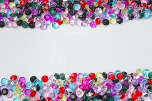 Colored decorative stones on a white background. photo