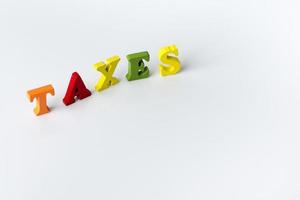 The word tax on white background photo