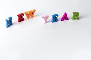 The word new year on white background photo