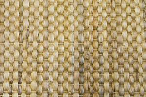 Bamboo woven beige mat handmade background. photo