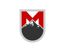 Simple shield with mountain and M letter initial inside vector