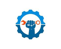 Mechanical gear with hand and wrench inside vector