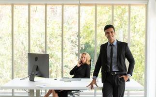 Businessmen and women analyze data and consult various issues photo