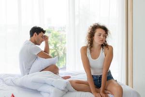 Lover in the white bedroom of the apartment with emotions displeased photo