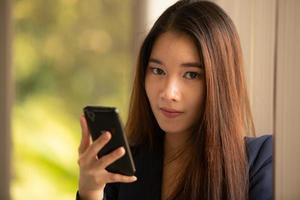 Young women are relaxing after working in an office setting with natural background photo