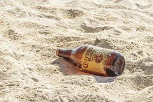 Playa del Carmen Mexico 05. August 2021 Corona beer bottles garbage pollution beach Playa del Carmen Mexico. photo