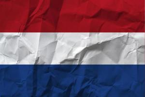 Netherlands national flag on crumpled paper. photo