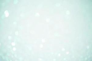 Defocus light blue sparkles glitter. Abstract background blur focus. photo