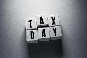 Tax Day Word with Wooden Cubes photo