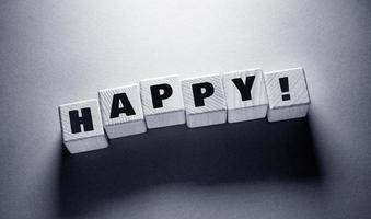 Happy Word with Wooden Cubes photo