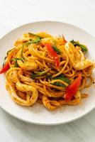 stir-fried spaghetti with salted egg and squid photo