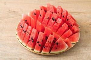 fresh watermelon sliced on plate photo