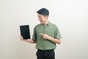 young Asian man using tablet photo