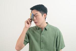 young Asian man stressing with credit card billing photo
