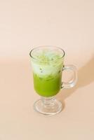 iced matcha green tea latte in glass photo
