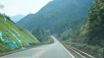 One countryside road across the mountains in the countryside of the China in spring photo