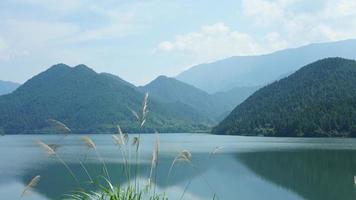 The beautiful lake landscapes surrounded by the green mountains in the countryside of the China photo