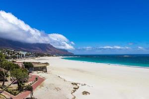 Camps Bay Beach and Table Mountain with clouds, Cape Town. photo
