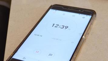 Close up on a digital timer counting in a smartphone with a broken screen video