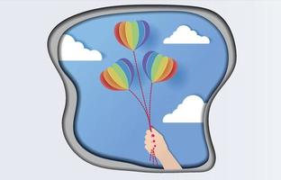 Pride Balloons in the Hand Paper Art Design vector