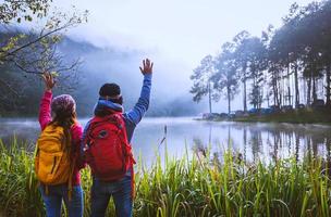 Couple lovers travel Beatiful nature at Pang ung lake and pine forest at Mae Hong Son in Thailand. photo