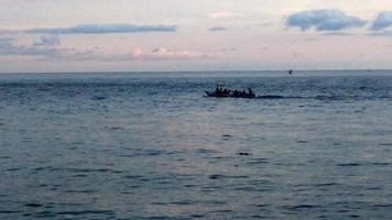 a boat in the middle of the sea. boat carrying tourists photo