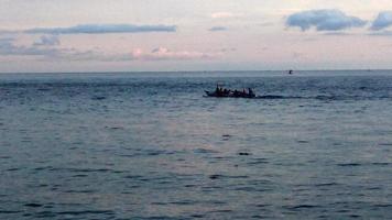 a boat in the middle of the sea. boat carrying tourists photo