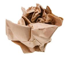 Brown paper crumpled into a ball. photo