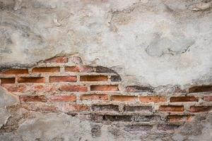 Aged street wall background, old red brick texture background photo