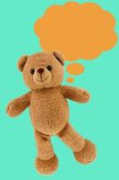 studio photo of brown light bear toy dialog