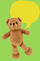 studio photo of brown light bear toy dialog