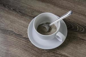 Cup of coffee on a wooden brown photo