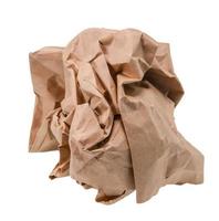 Brown paper crumpled into a ball. photo