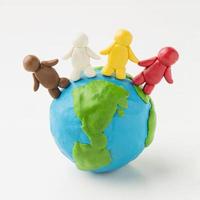 front view plasticine earth globe with people photo