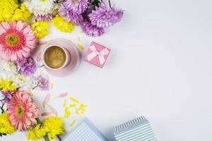 fresh flowers near cup drink present boxes petals photo