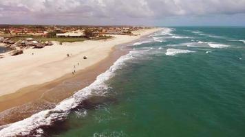 Panoramic view of a drone flying over the beach and cloudy sky