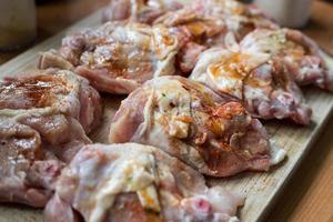 Raw meat in marinade waiting to be fried photo