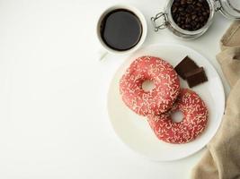 Pink donuts with sprinkles photo