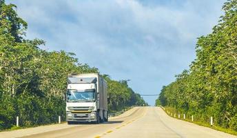 Driving truck on the highway in jungle tropical nature Mexico. photo