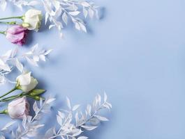 Frame of white branches on a blue background photo