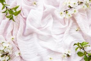 Pink  fabric and spring blossom photo