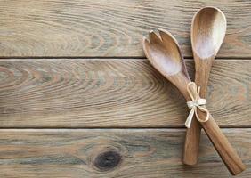 Two wooden salad spoons photo