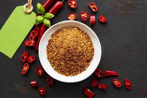 Red chili pepper, dried chillies on dark background. Top view photo