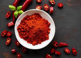 Red chili pepper, dried chillies on dark background. Top view photo