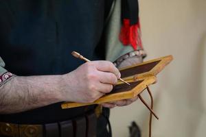 Roman writing on wax tablet photo