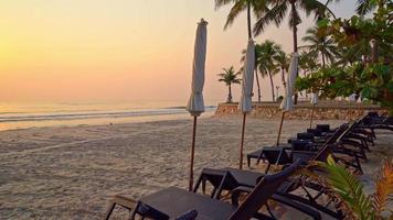 umbrella with beach chair and ocean sea background - holiday and vacation concept video