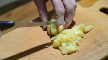 Slicing boiled potatoes with a knife video